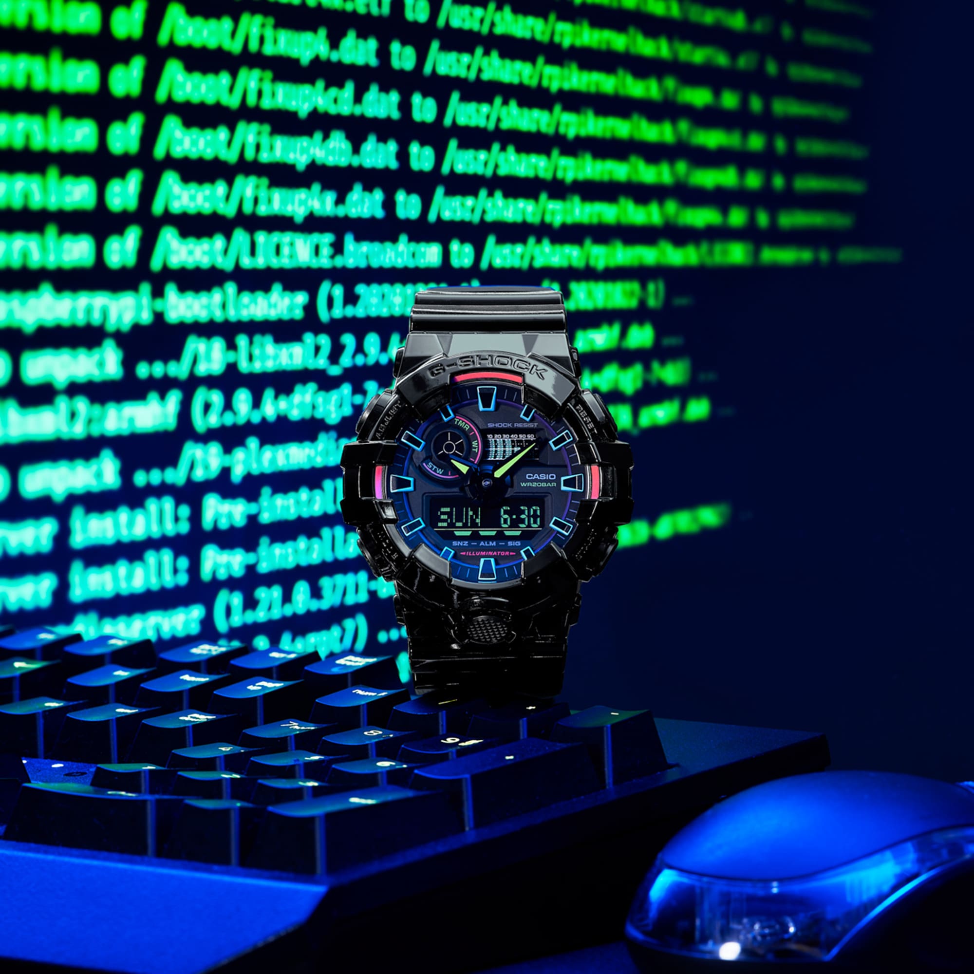 G-SHOCK RGB Gamer watch in front of monitor with command line 