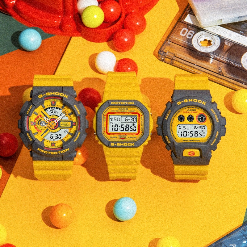 DW5610Y-9, DW69000Y-9, GA110Y-9A Digital and Analog Digital watches on a bright colorful yellow background