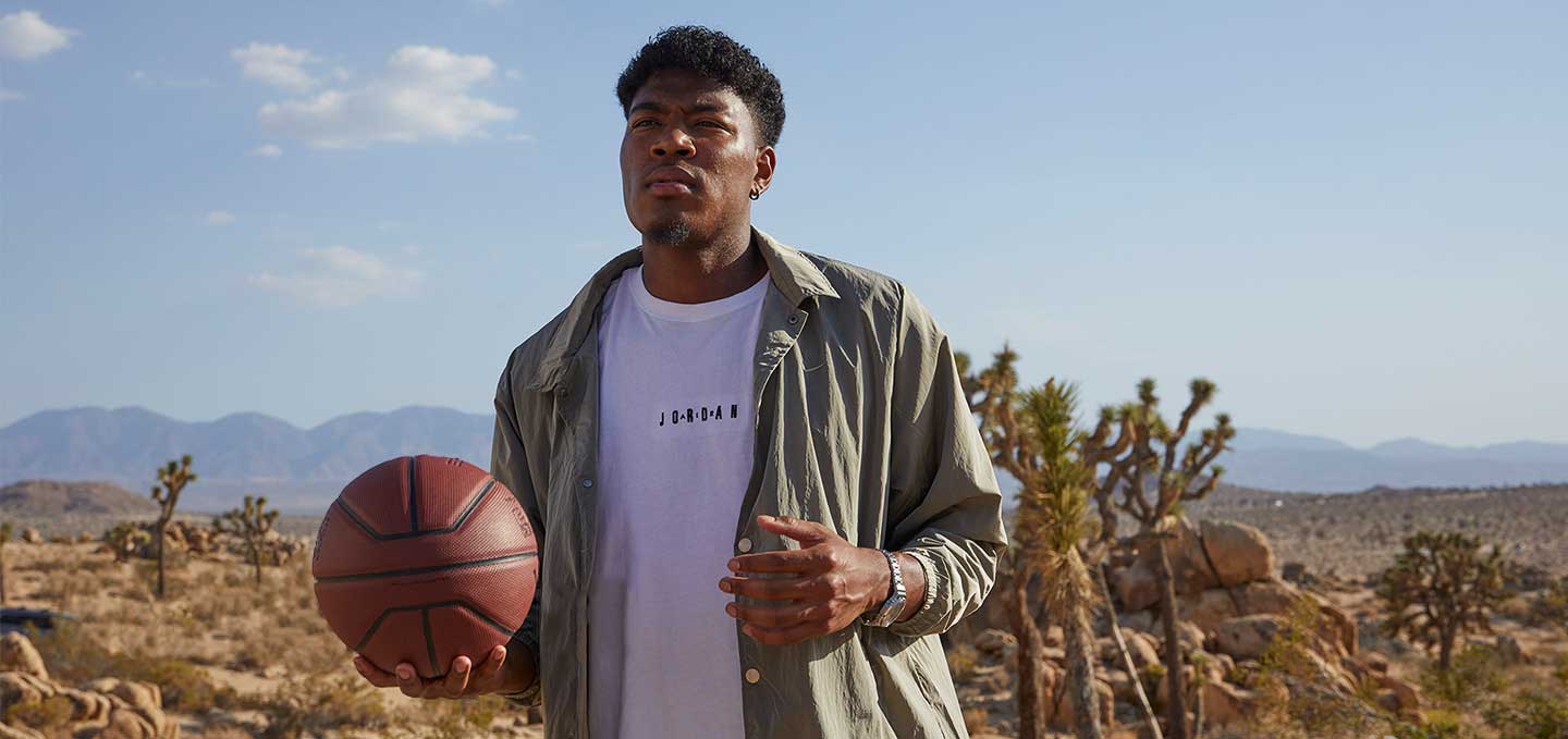 Basketball player Rui Hachimura outdoors with a basketball, GSHOCK watch
