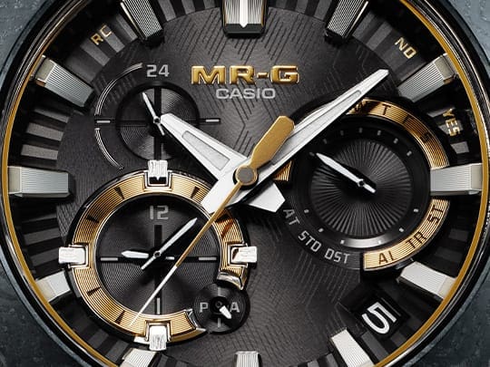 MRGB2000GA-1A Analog watch face close up, with gold gray and silver accents