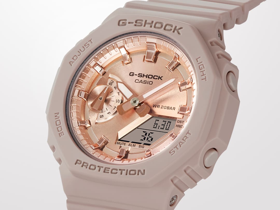 Close up of G-SHOCK GMAS2100MD-4A analog digital watch with pink gold watch face