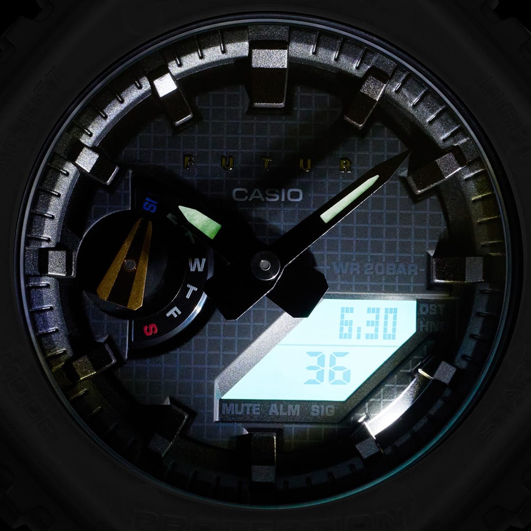 GA-2100FT-8A gray analog digital face in darkness backlight illuminated with grid, Casio, and FUTUR logo