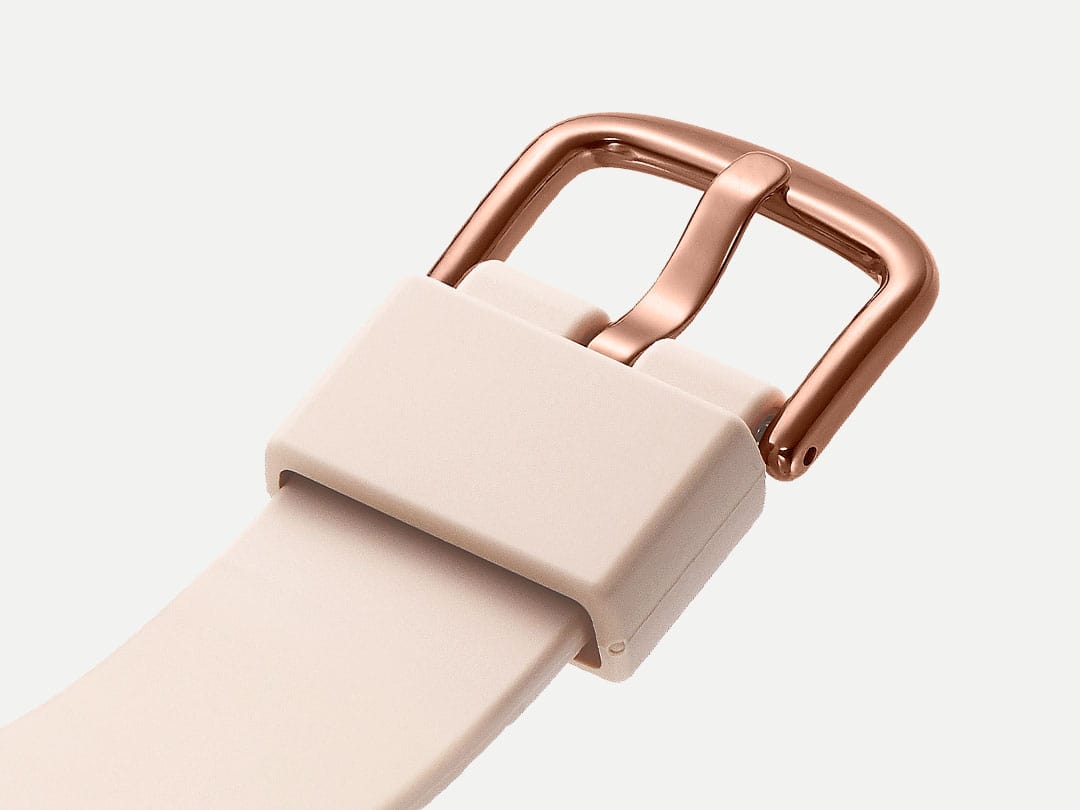 tan/pink watch band detail with rose gold clasp