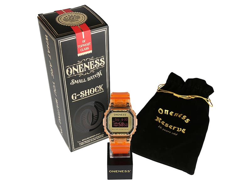 Shot of G-SHOCK x Oneness DW5600ONS23-4 special packaging inspired by Kentucky bourbon packaging, complete with a fabric bag and branded stand for safe keeping while not in wear