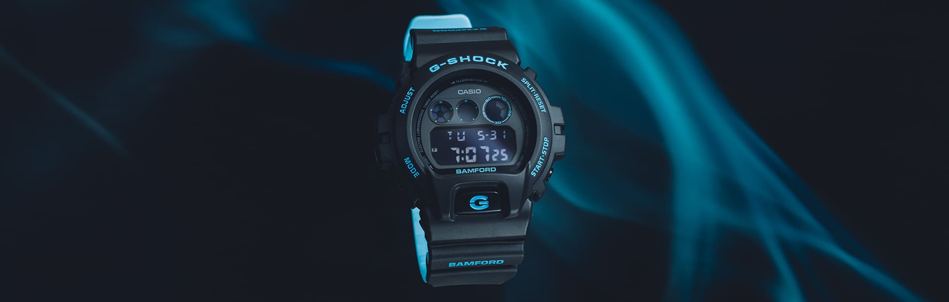 DW6900BWD Bamford x G-SHOCK watch on a black background with blue aura