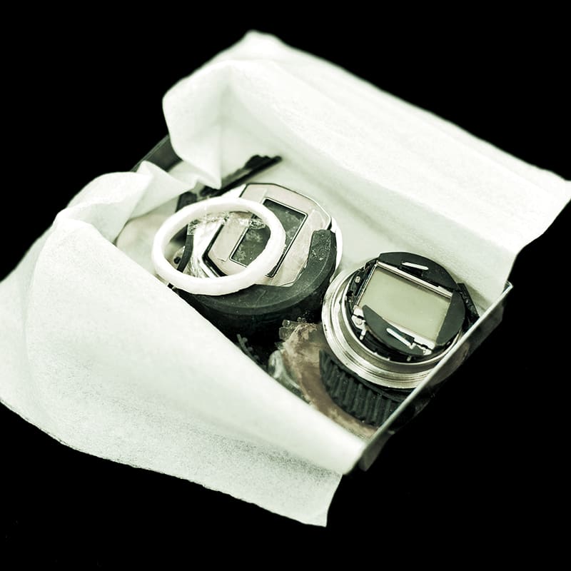 Damaged G-SHOCK parts in a container