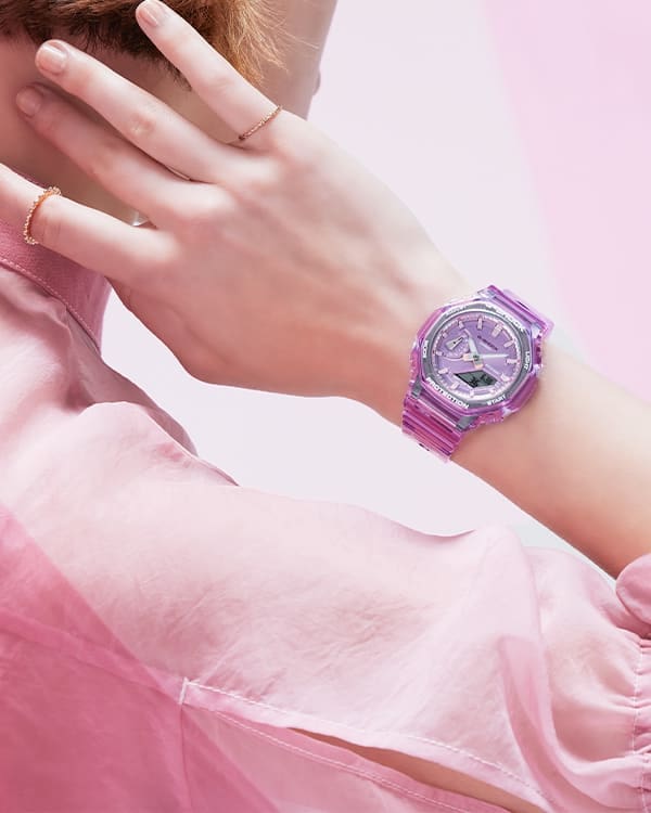 Close up of model's wrist in pink clothes posing with pink transparent GMAS2100SK