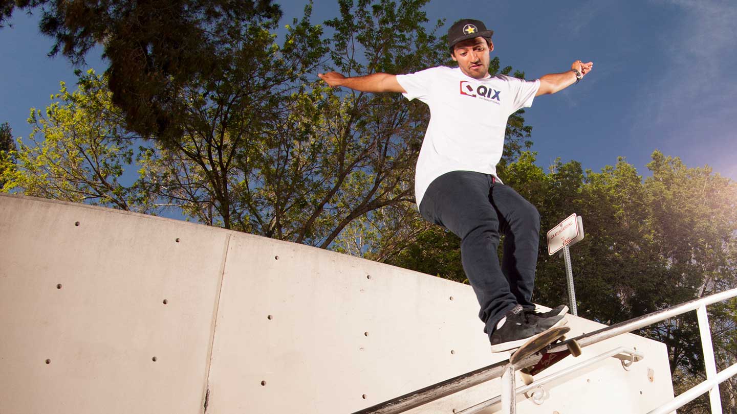 Kelvin Hoefler doing a skateboard trick near a wall