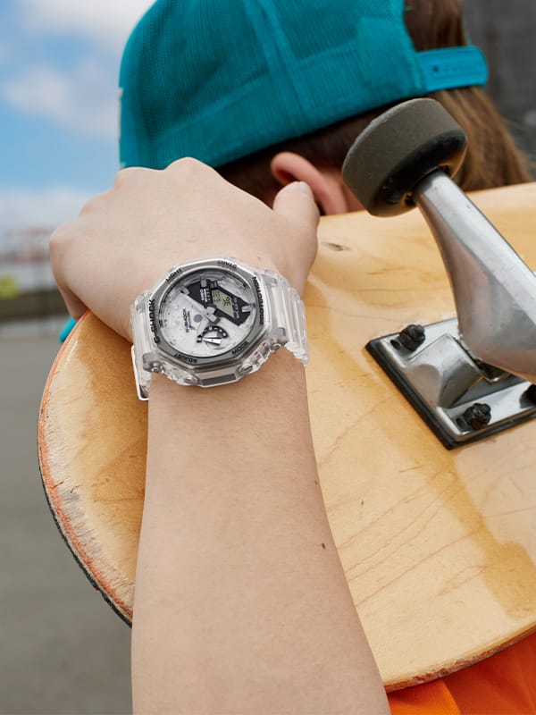 Skateboarder wearing a G-SHOCK Clear remix analog digital watch on his wrist