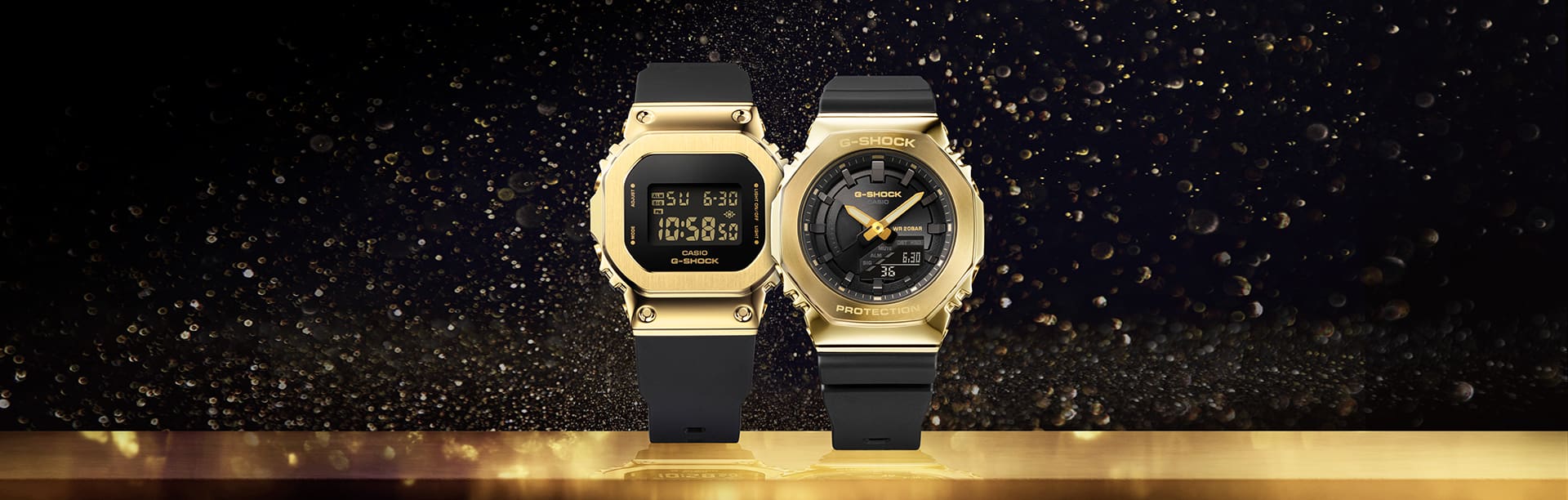 GM-2100GB-S2100GB Gold Watches with black bands on a reflective gold surface with a black background