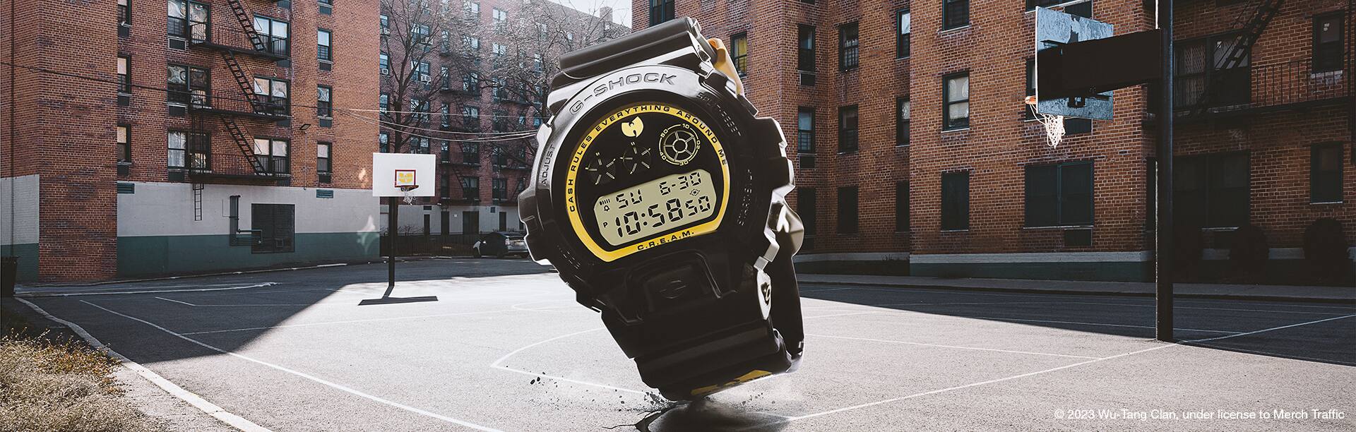 Wu-Tang watch in the foreground and NYC basketball court and apartment building in the background